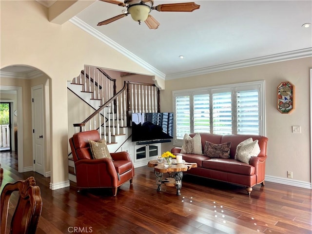 living area featuring arched walkways, wood finished floors, vaulted ceiling, ceiling fan, and stairway