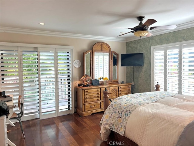 bedroom with wallpapered walls, ceiling fan, crown molding, and dark wood-type flooring