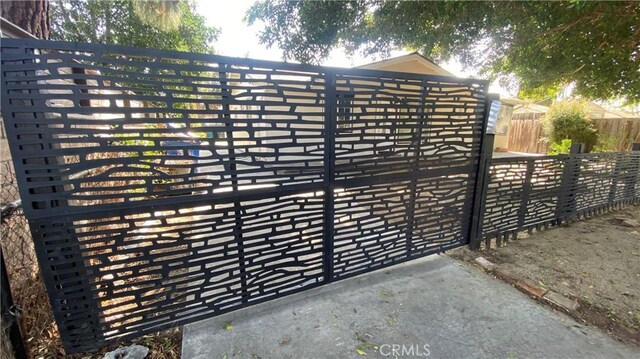 view of gate featuring fence