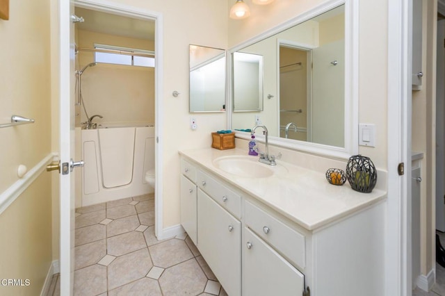 15413 Village 15, Camarillo, CA 93012 - full bathroom with a bath, baseboards, toilet, vanity, and tile patterned flooring