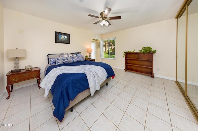 15413 Village 15, Camarillo, CA 93012 - bedroom with a ceiling fan, light tile patterned floors, a closet, and baseboards