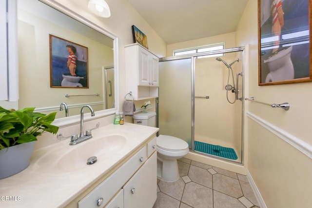 15413 Village 15, Camarillo, CA 93012 - bathroom featuring a shower stall, toilet, tile patterned flooring, and vanity