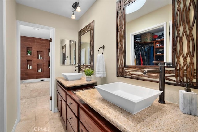 620 S Catalina Ave Unit C, Redondo Beach, CA 90277 - bathroom with double vanity, tiled shower, tile patterned floors, and a spacious closet