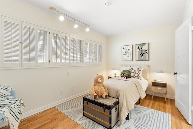 1451 Savoy Cir, San Diego, CA 92107 - bedroom with light wood-style floors, crown molding, and rail lighting