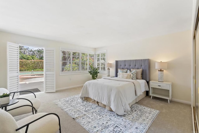1451 Savoy Cir, San Diego, CA 92107 - bedroom with light carpet, access to exterior, and multiple windows