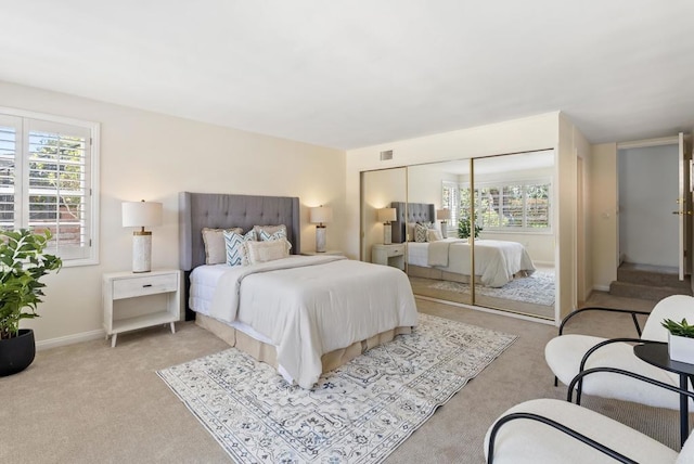 1451 Savoy Cir, San Diego, CA 92107 - bedroom featuring light colored carpet, multiple windows, and a closet