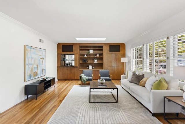 1451 Savoy Cir, San Diego, CA 92107 - living room with crown molding, built in features, light wood-type flooring, and a skylight