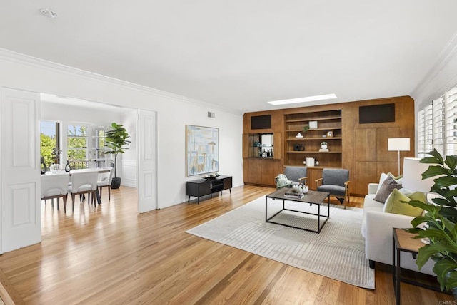 1451 Savoy Cir, San Diego, CA 92107 - living area with ornamental molding, built in shelves, and light wood-style floors