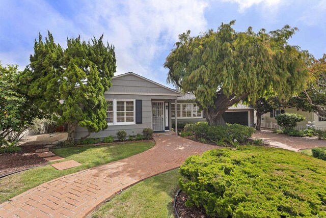 1451 Savoy Cir, San Diego, CA 92107 - view of front of property with a front lawn and decorative driveway