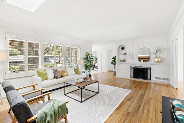 1451 Savoy Cir, San Diego, CA 92107 - living area with light wood-type flooring, a fireplace, and ornamental molding