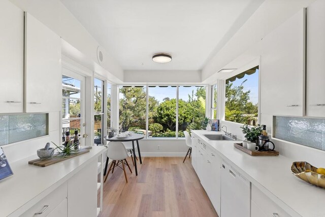 1451 Savoy Cir, San Diego, CA 92107 - kitchen featuring light countertops, white cabinets, and light wood-type flooring