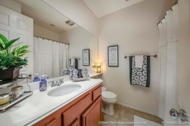 bathroom with tile patterned floors, toilet, visible vents, baseboards, and vanity