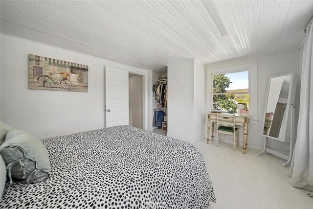 bedroom with wooden ceiling and a closet