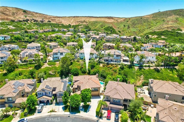 drone / aerial view featuring a mountain view and a residential view