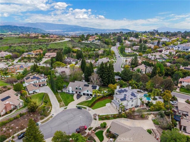 birds eye view of property with a residential view and a mountain view