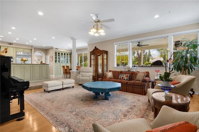 748 E Mariposa Dr, Redlands, CA 92373 - living room with ceiling fan, light wood-style floors, ornate columns, and recessed lighting