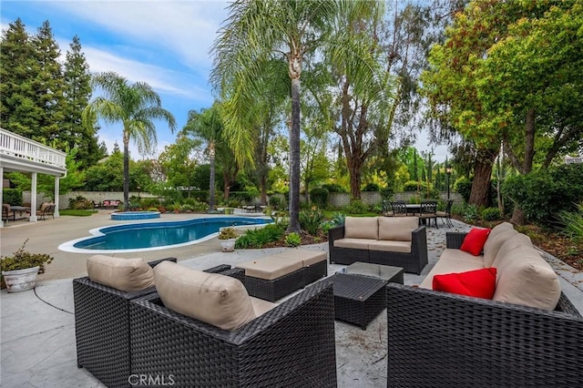 748 E Mariposa Dr, Redlands, CA 92373 - view of swimming pool featuring an outdoor hangout area, a patio area, a fenced backyard, and view of wooded area