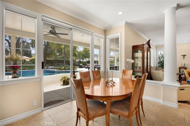 dining room with ornate columns, a ceiling fan, plenty of natural light, and ornamental molding