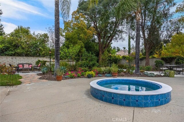 748 E Mariposa Dr, Redlands, CA 92373 - view of pool with a patio area, fence, an in-ground hot tub, and an outdoor living space