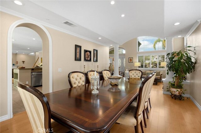 748 E Mariposa Dr, Redlands, CA 92373 - dining room featuring decorative columns, light wood finished floors, arched walkways, recessed lighting, and baseboards
