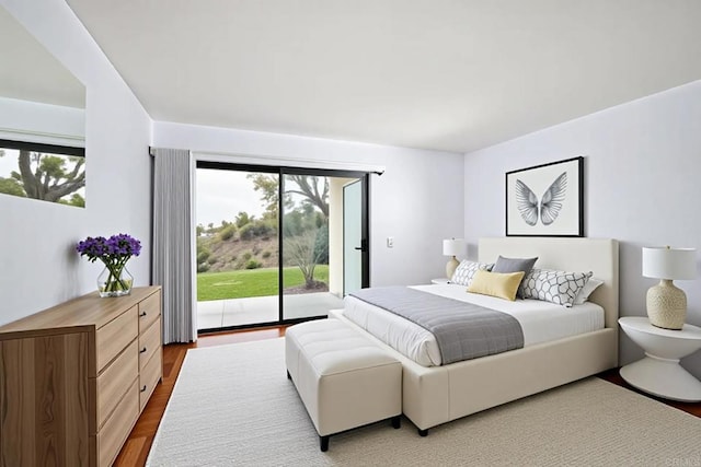 3116 Vista Bonita, Carlsbad, CA 92009 - bedroom with multiple windows, wood finished floors, and access to exterior
