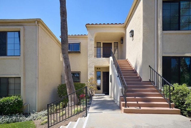3116 Vista Bonita, Carlsbad, CA 92009 - property entrance featuring a tiled roof and stucco siding