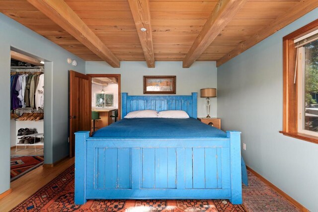 25770 E Grade Rd, Santa Ysabel, CA 92070 - bedroom featuring wood finished floors, wooden ceiling with exposed beams, and baseboards