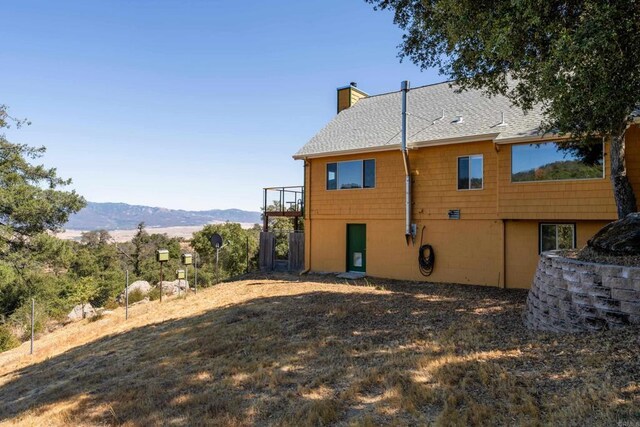 25770 E Grade Rd, Santa Ysabel, CA 92070 - rear view of property featuring a chimney, a mountain view, and roof with shingles