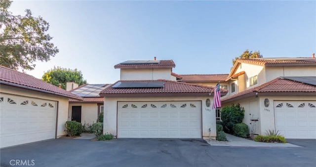 1497 Chaparral Way, Oceanside, CA 92057 - mediterranean / spanish house featuring roof mounted solar panels and stucco siding