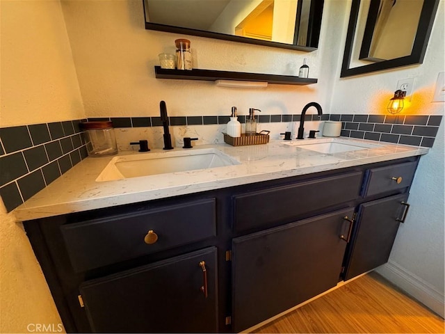 1497 Chaparral Way, Oceanside, CA 92057 - bathroom with double vanity, tasteful backsplash, and wood finished floors