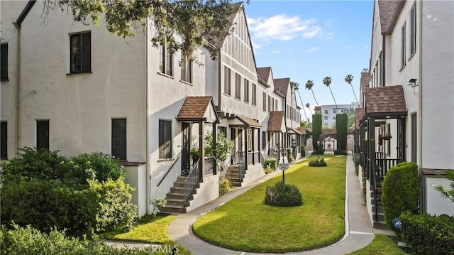 view of community with a yard and a residential view