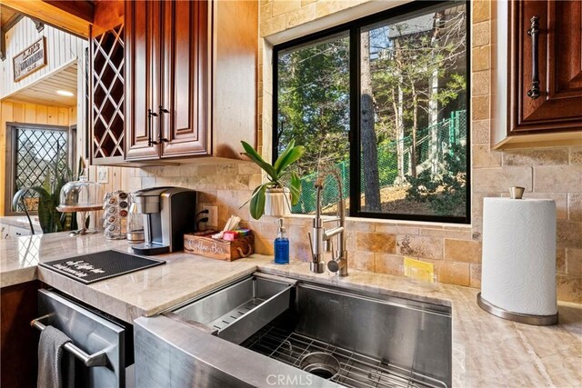 675 Grass Valley Rd, Lake Arrowhead, CA 92352 - kitchen with decorative backsplash, light stone countertops, and stainless steel dishwasher