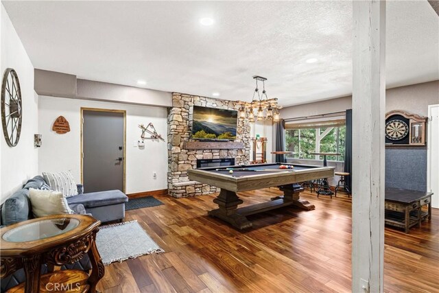 675 Grass Valley Rd, Lake Arrowhead, CA 92352 - rec room with wood finished floors, a fireplace, baseboards, a textured ceiling, and pool table