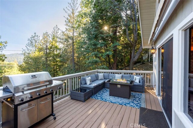 675 Grass Valley Rd, Lake Arrowhead, CA 92352 - wooden terrace featuring a grill and an outdoor living space with a fire pit