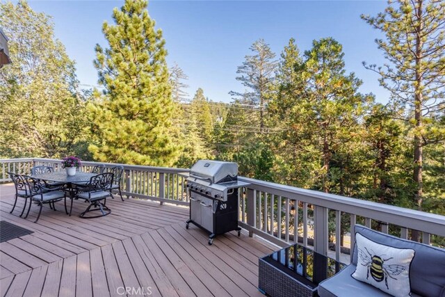 675 Grass Valley Rd, Lake Arrowhead, CA 92352 - wooden deck featuring outdoor dining area and a grill