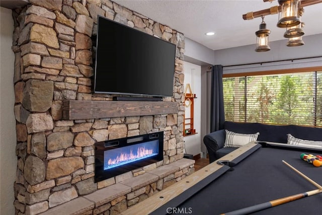 675 Grass Valley Rd, Lake Arrowhead, CA 92352 - playroom with baseboards and a stone fireplace