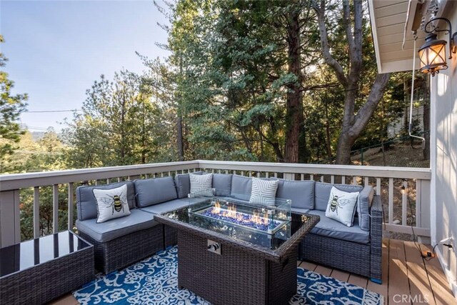 675 Grass Valley Rd, Lake Arrowhead, CA 92352 - wooden terrace featuring an outdoor living space with a fire pit