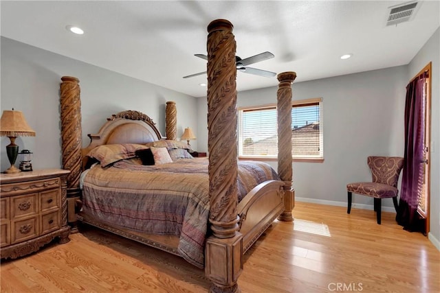 bedroom featuring baseboards, light wood-type flooring, visible vents, and recessed lighting