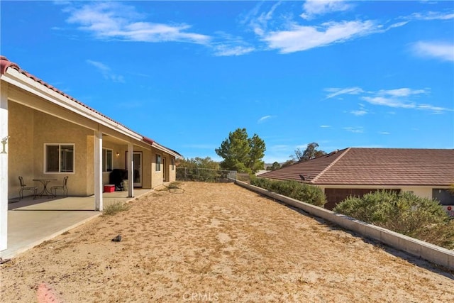 view of yard with a fenced backyard and a patio area