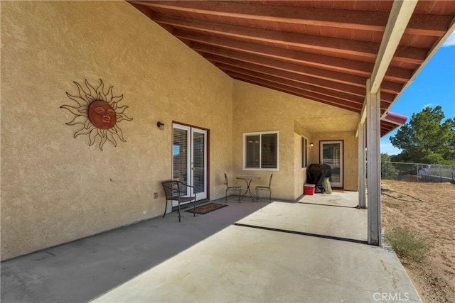 view of patio featuring fence