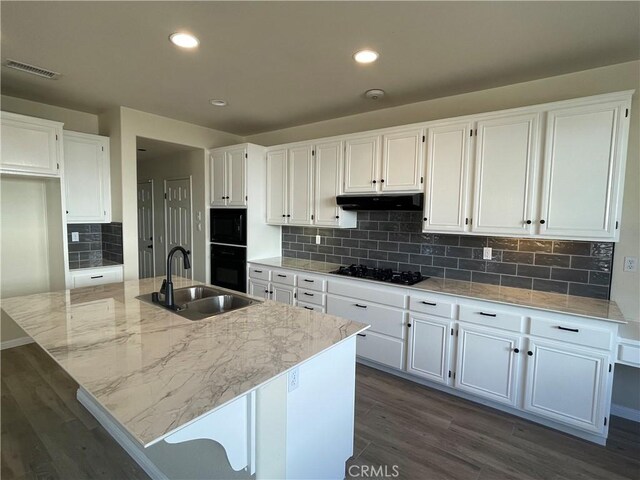 32706 Blue Mist Way, Wildomar, CA 92595 - kitchen with dark wood-type flooring, a sink, white cabinetry, and black appliances