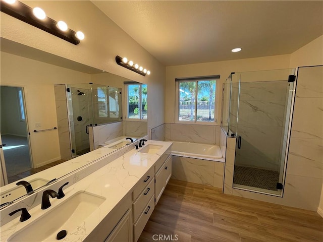 32706 Blue Mist Way, Wildomar, CA 92595 - bathroom with a garden tub, wood finished floors, a sink, and a marble finish shower