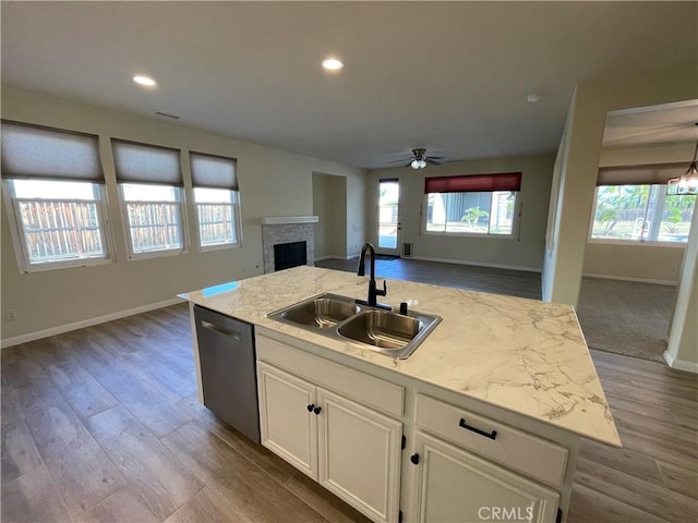 32706 Blue Mist Way, Wildomar, CA 92595 - kitchen featuring white cabinets, a ceiling fan, stainless steel dishwasher, a sink, and open floor plan