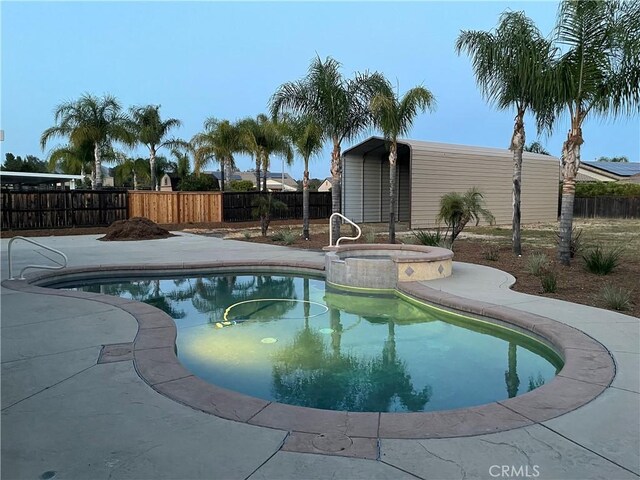 32706 Blue Mist Way, Wildomar, CA 92595 - view of swimming pool featuring a fenced backyard, a fenced in pool, an outdoor structure, and an in ground hot tub