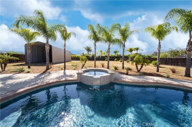 32706 Blue Mist Way, Wildomar, CA 92595 - view of swimming pool with a fenced backyard, a fenced in pool, and an in ground hot tub