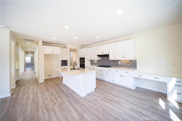 32706 Blue Mist Way, Wildomar, CA 92595 - kitchen featuring a sink, black appliances, white cabinets, under cabinet range hood, and visible vents