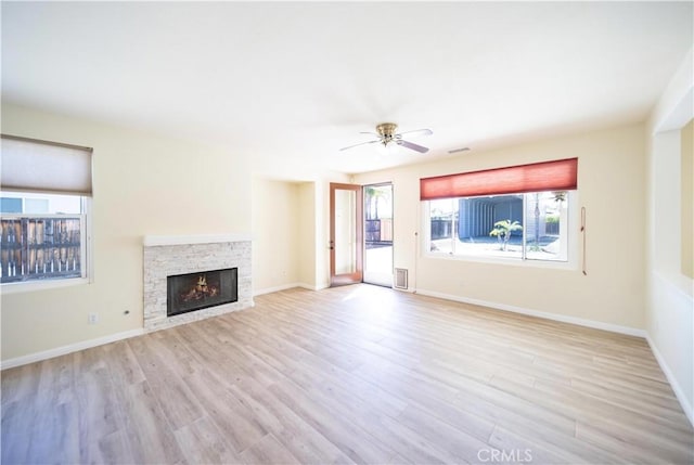 32706 Blue Mist Way, Wildomar, CA 92595 - unfurnished living room featuring a fireplace, wood finished floors, a ceiling fan, and baseboards