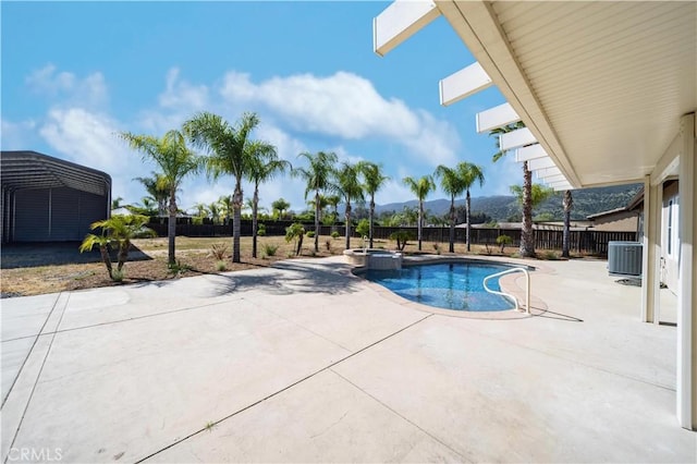 32706 Blue Mist Way, Wildomar, CA 92595 - view of pool with a fenced backyard, central AC unit, a mountain view, a pool with connected hot tub, and a patio
