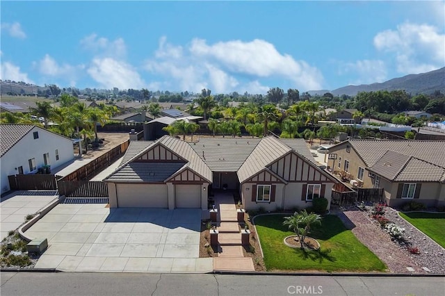 32706 Blue Mist Way, Wildomar, CA 92595 - view of front of home featuring driveway, fence, a mountain view, a garage, and a residential view