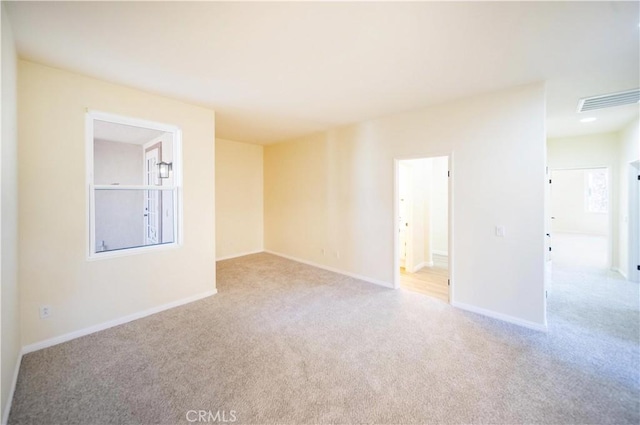 32706 Blue Mist Way, Wildomar, CA 92595 - unfurnished room featuring baseboards, visible vents, and carpet